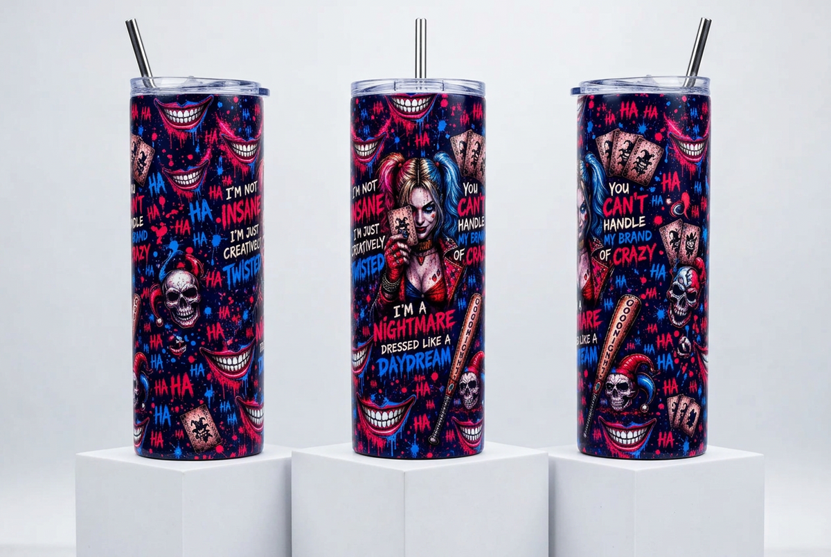 Three tall insulated tumblers with clear lids and metal straws, standing on white pedestals against a light gray studio background. The tumblers feature a vivid horror-themed print with skulls, smiling teeth, playing cards, and bold text including 'I'M A NIGHTMARE DRESSED LIKE A DAYDREAM' and 'YOU CAN'T HANDLE ME OR CRAZY'.