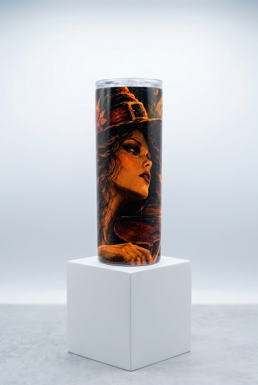 Close-up violin witch tumbler on a white box stand