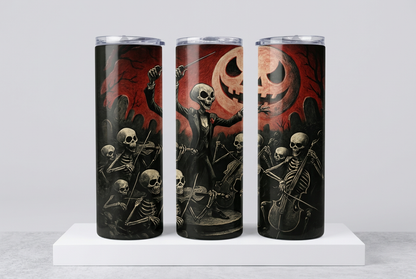 Three rotated views of the Halloween skeleton orchestra tumbler wrap