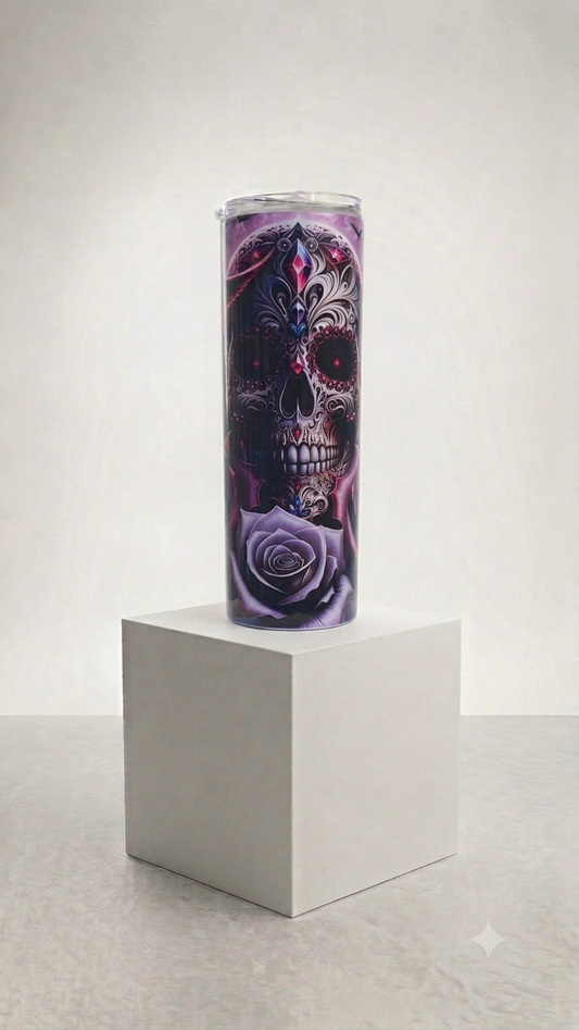 Sugar Skull Filigree Skinny Tumbler with ornate navy sugar skull ruby red eyes pink gemstone and lavender rose on purple smoky background